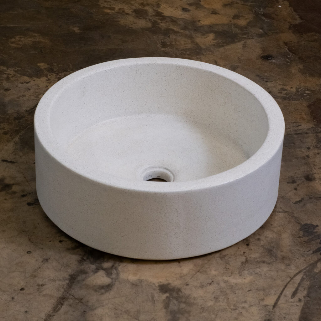 Side view of Stonecast's Hatbox Bowl in Sandstone White
