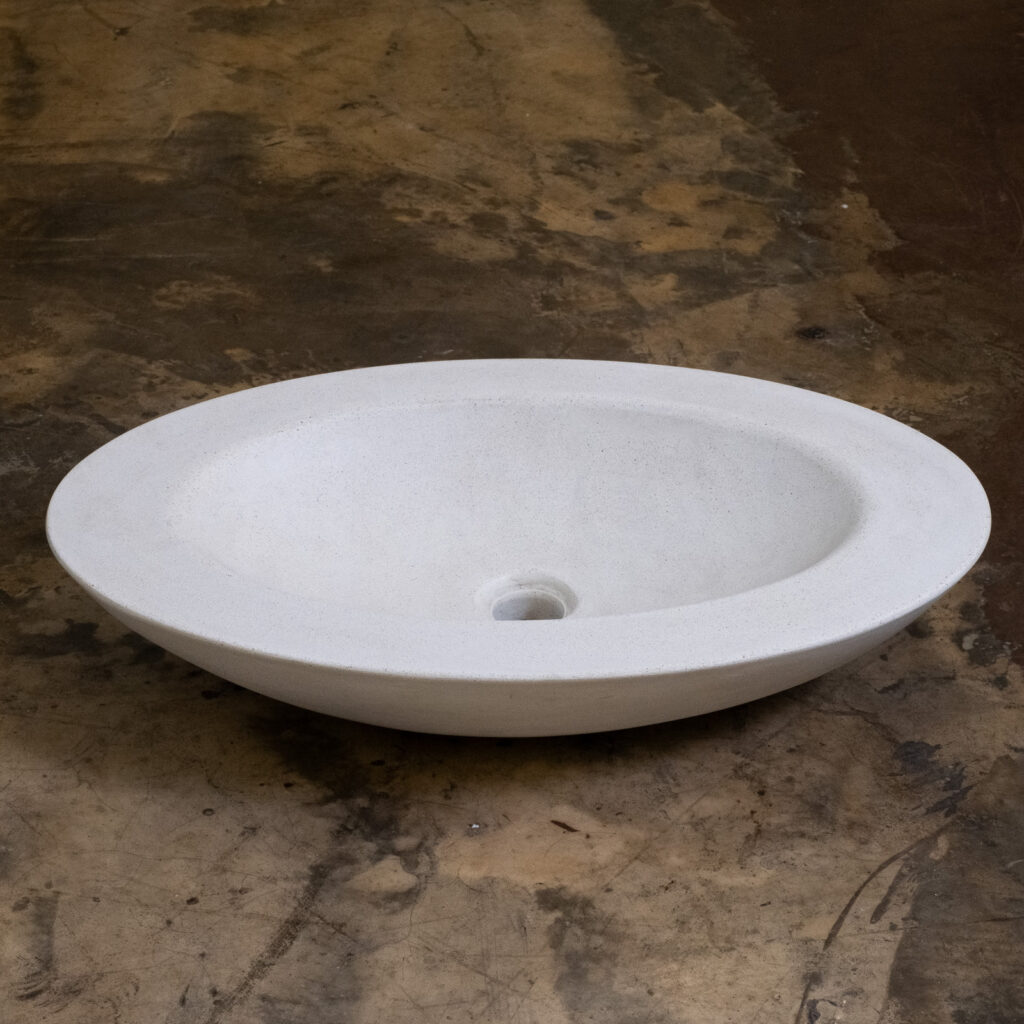 Side view of Stonecast's Olive basin in Sandstone White