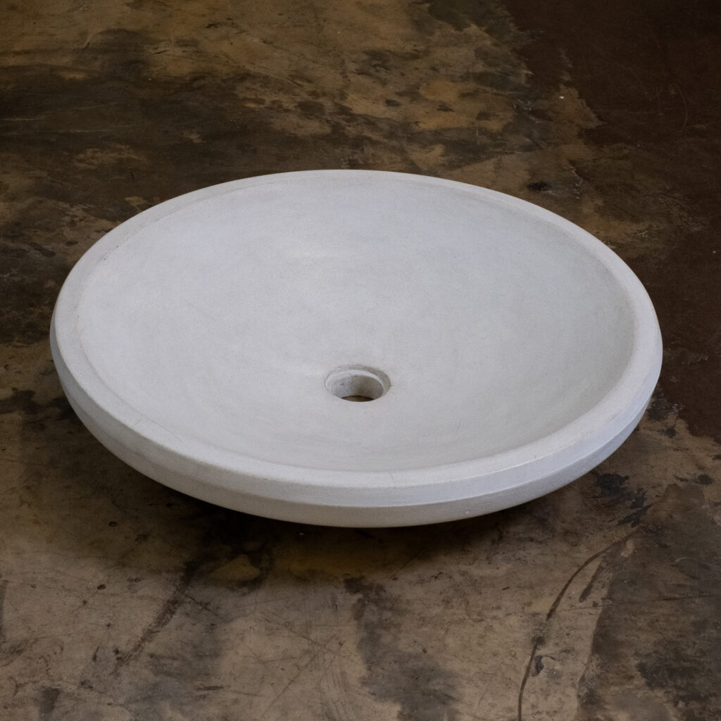 Side view of Stonecast's Onguma basin in Sandstone White