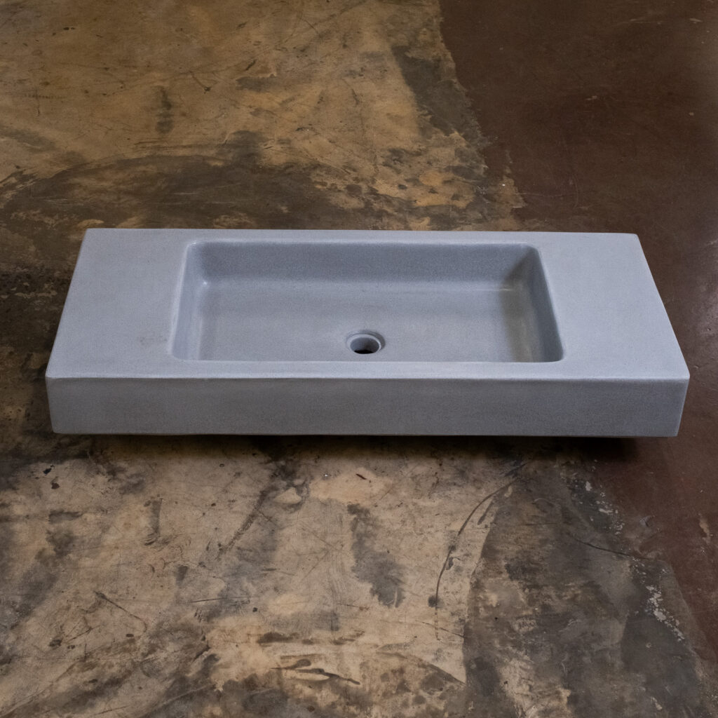 Side view of Stonecast's Paternoster basin in Portland Grey