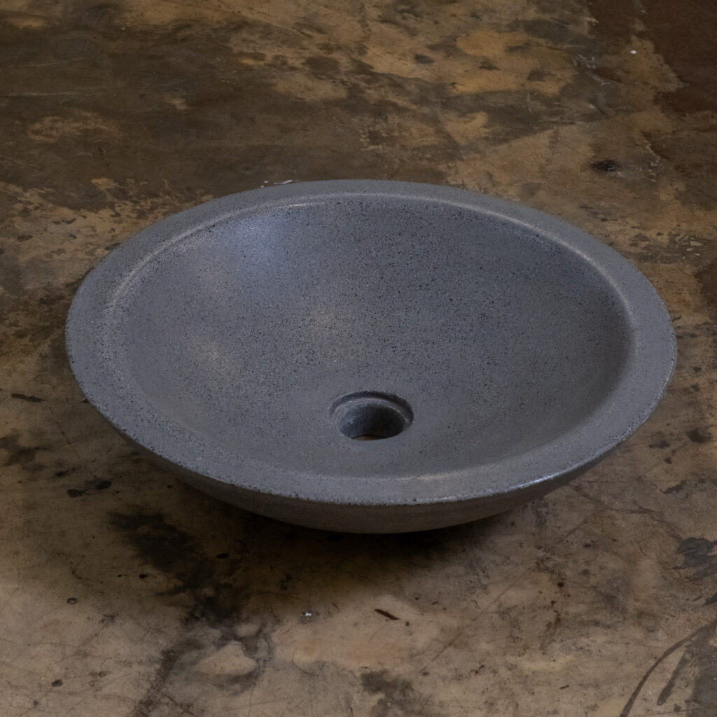 Side view of Stonecast's Piccola basin in Charcoal Grey