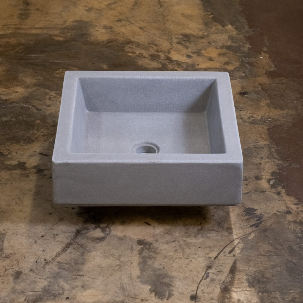 Side view of Stonecast's Wasabi basin in Wolf Grey