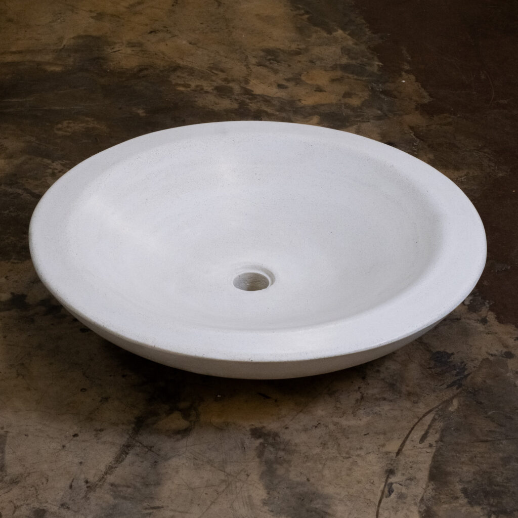 Side view of Stonecast's Zen Dynasty basin in Sandstone White