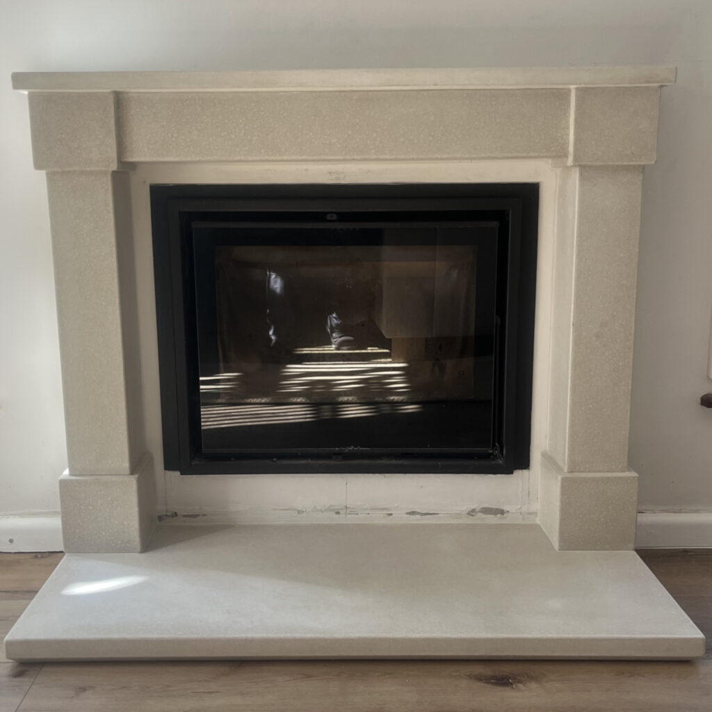 Stonecast custom concrete fireplace surround with square detailing