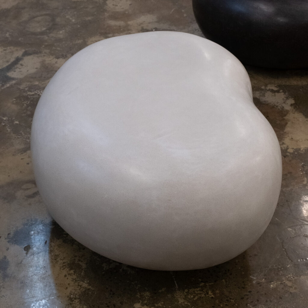 Side view of the medium Stonecast Pebble Bench in wolf grey
